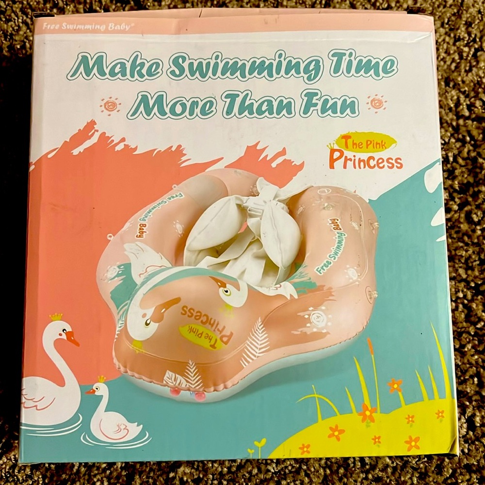 Pink princess swim float. New. Includes pump, two small toys.